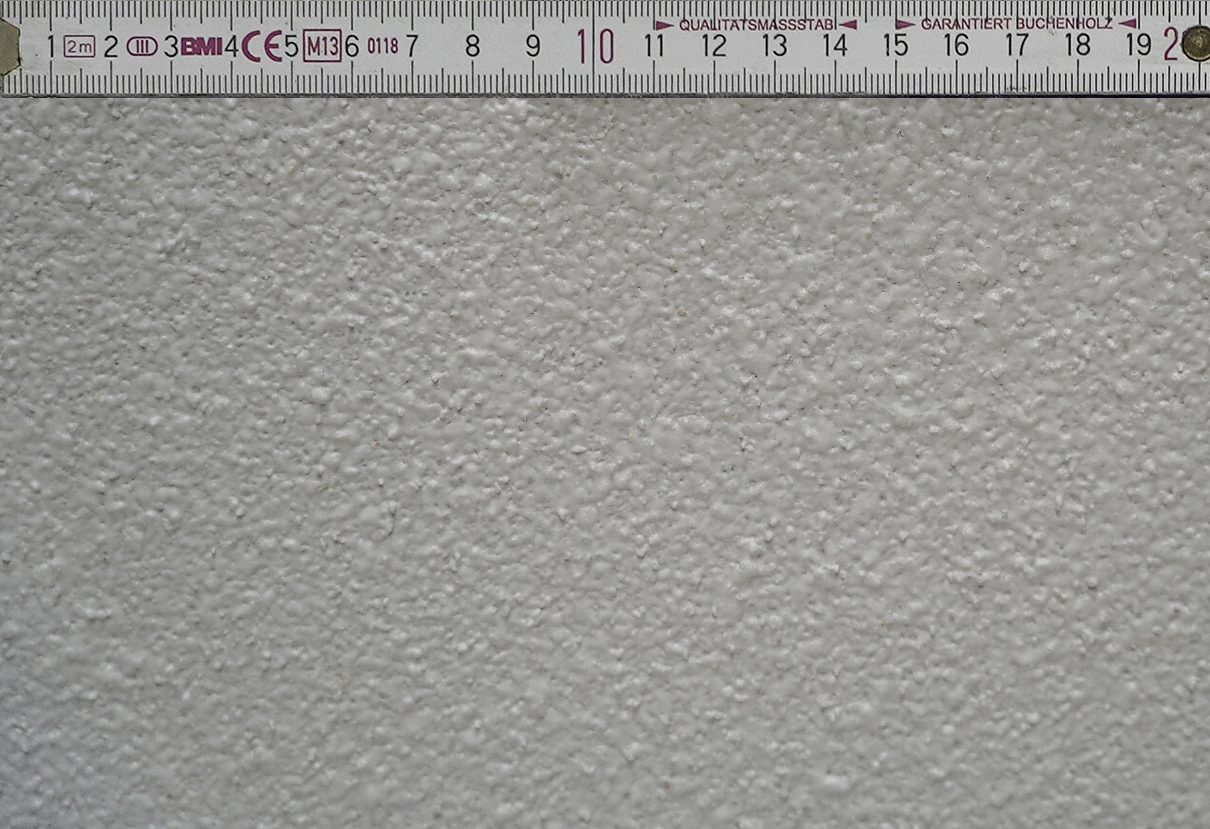 Oberfläche eines Strukturputz Innen an einer Hauswand