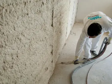 Professional installation of thermal insulation on an interior wall