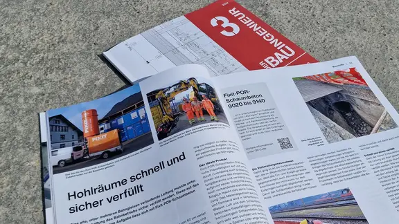 Titelblatt des Magazins "Der Bauingenieur" mit dem aufgeschlagenen Artikel zur Fixit POR Leitungsverfüllung am Bahnhof Schwyz